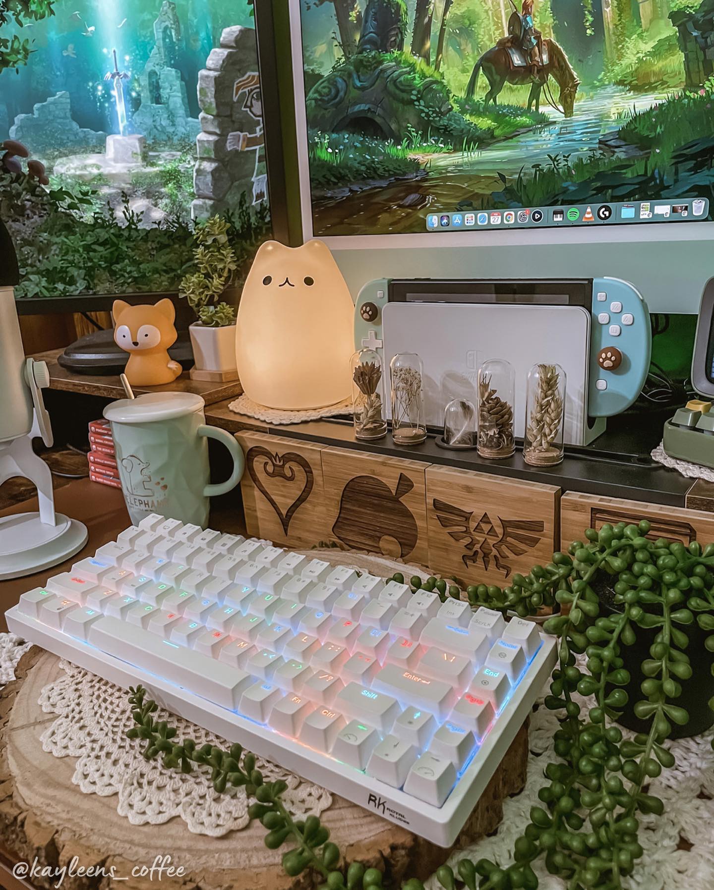 Royal Kludge RK84 75 percent wireless keyboard showcasing its colorful backlighting and compact TKL layout, placed on a desk with decorative elements
