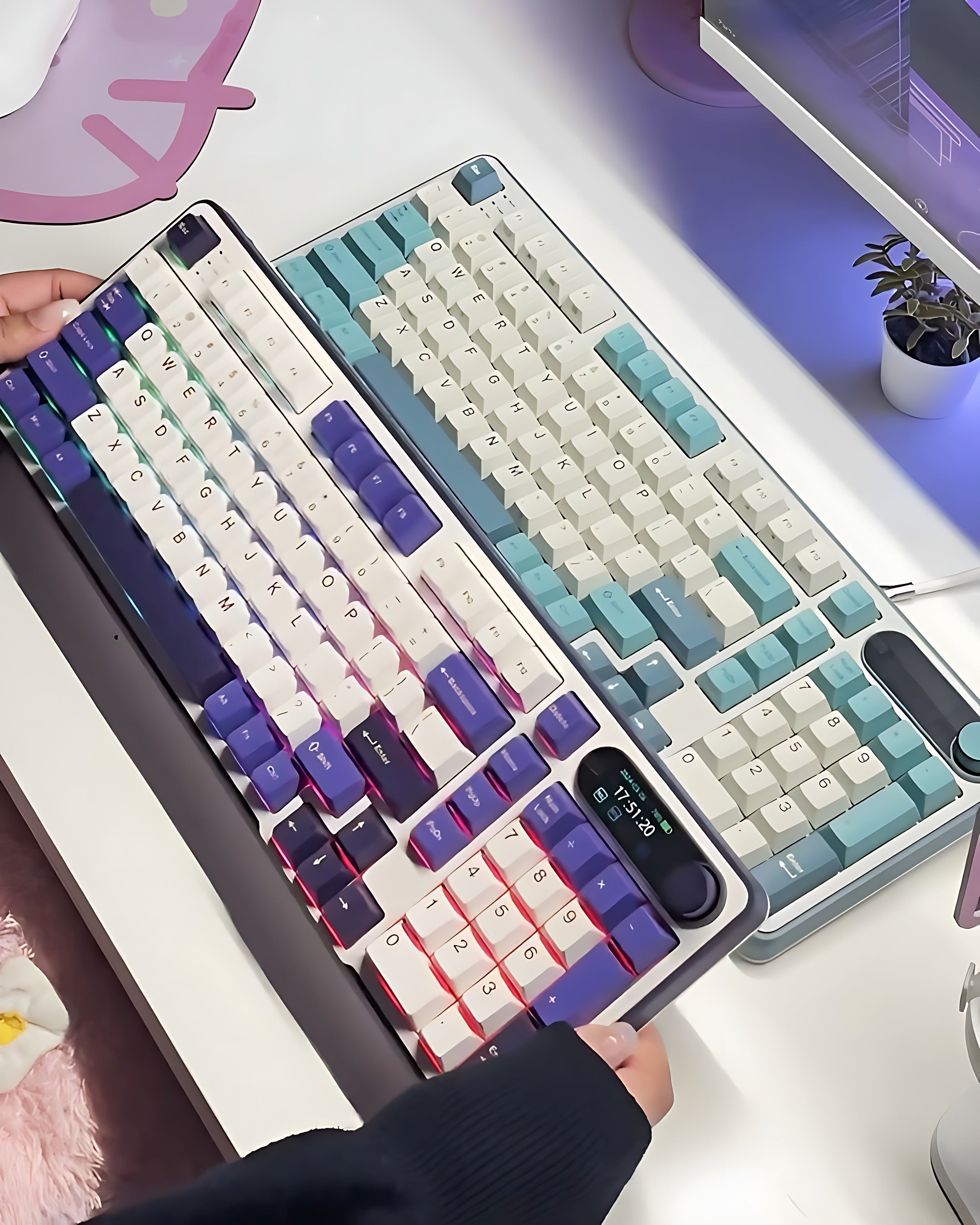 Close-up of a hand holding a Royal Kludge S98 Gaming keyboard with colorful keycaps in purple and sky blue