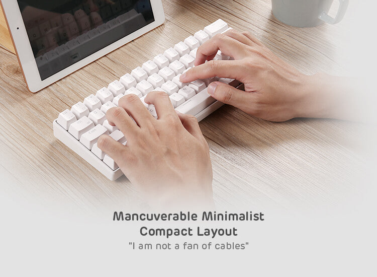 Person typing on the Royal Kludge RK61 60% keyboard in a minimalist setup, showcasing its compact and maneuverable design, ideal for cable-free use